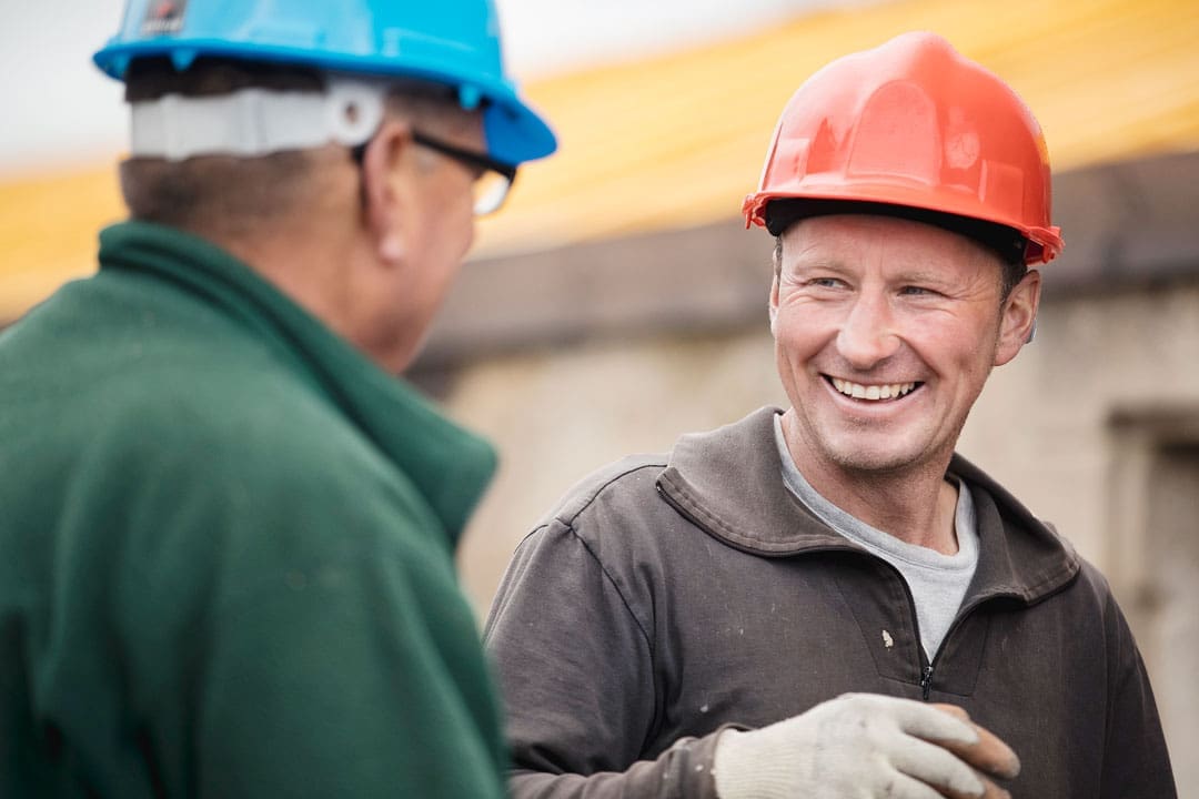 2 construction workers one smiling