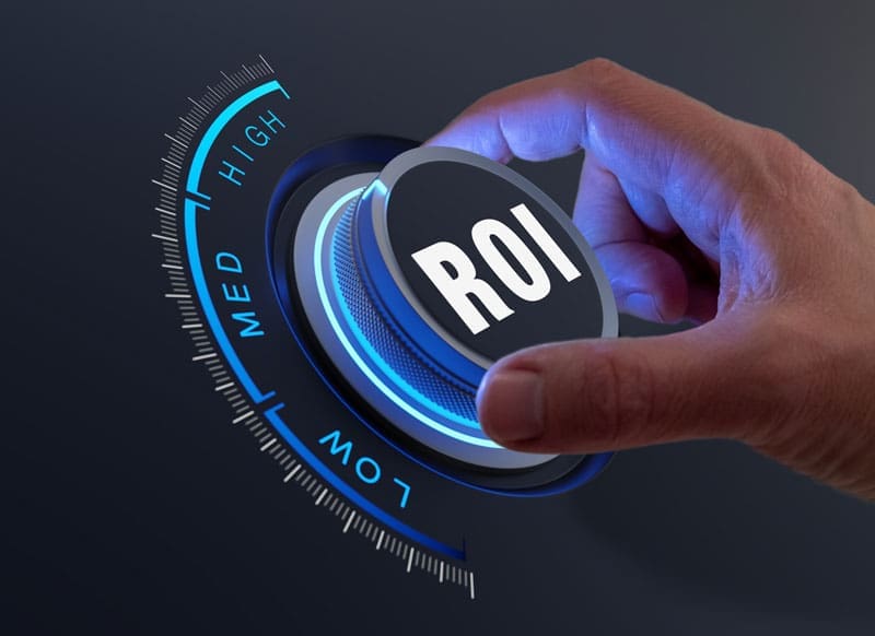 hand turning a ROI gauge up to high