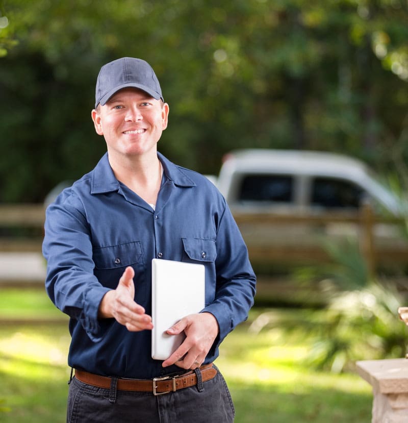 Pest control Technician greeting client at the door