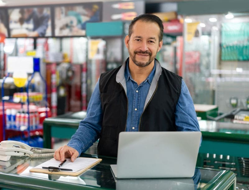 Business-owner-home-services Owner of a home service business looking at a Laptop